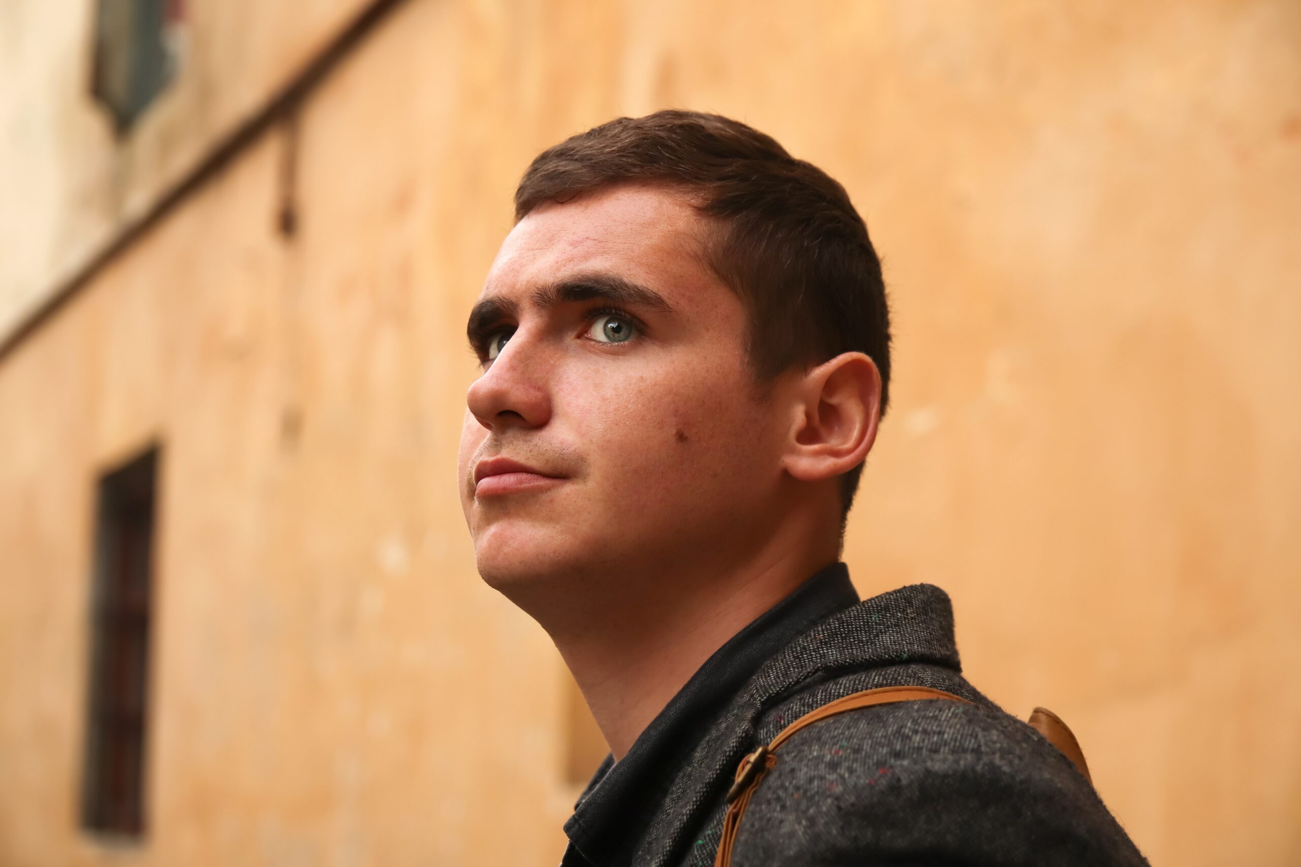 Portrait,Young,Man,On,Aged,Yellow,Background.,Serious,Young,Man.